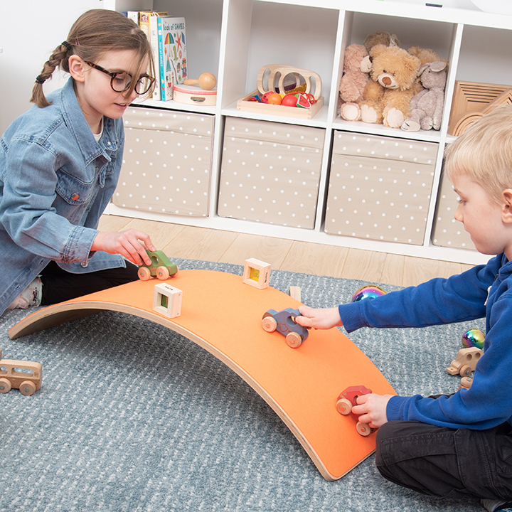 Board upturned for playing with cars