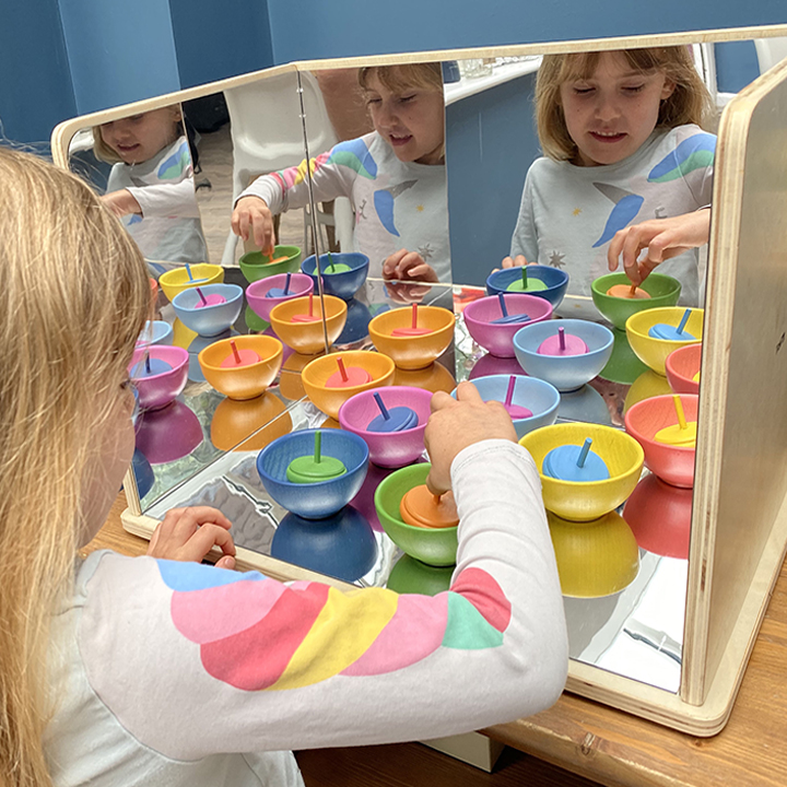 Child playing with infinite reflections