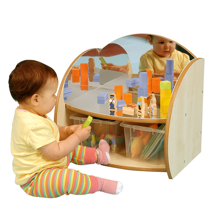 Little child playing in mirrors