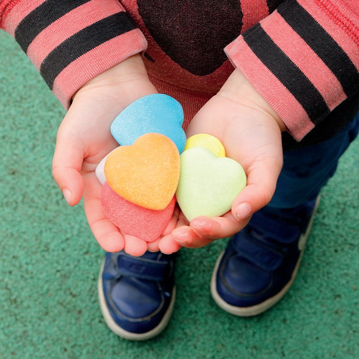 Kindness Hearts in childrens hands