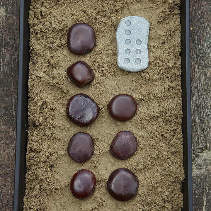 Sandpit tactile counting stones