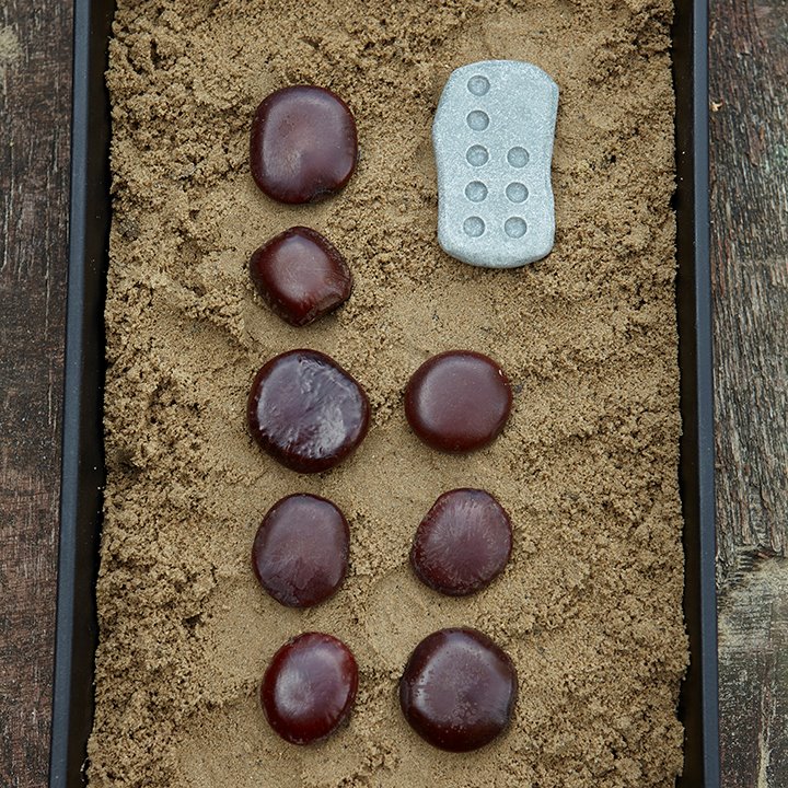 Sandpit tactile counting stones