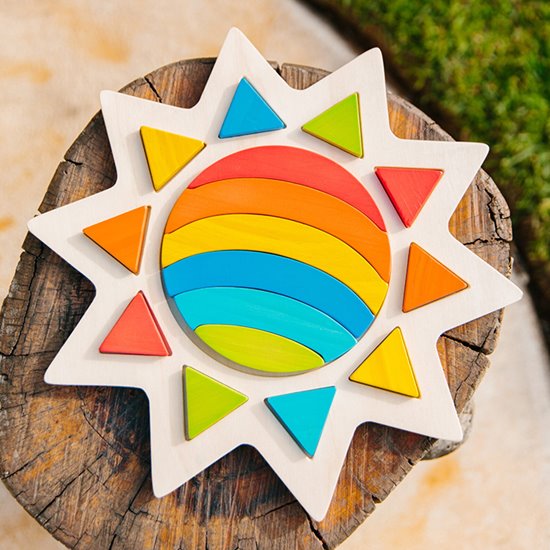 Wooden tuna shaped puzzle with rainbow pieces