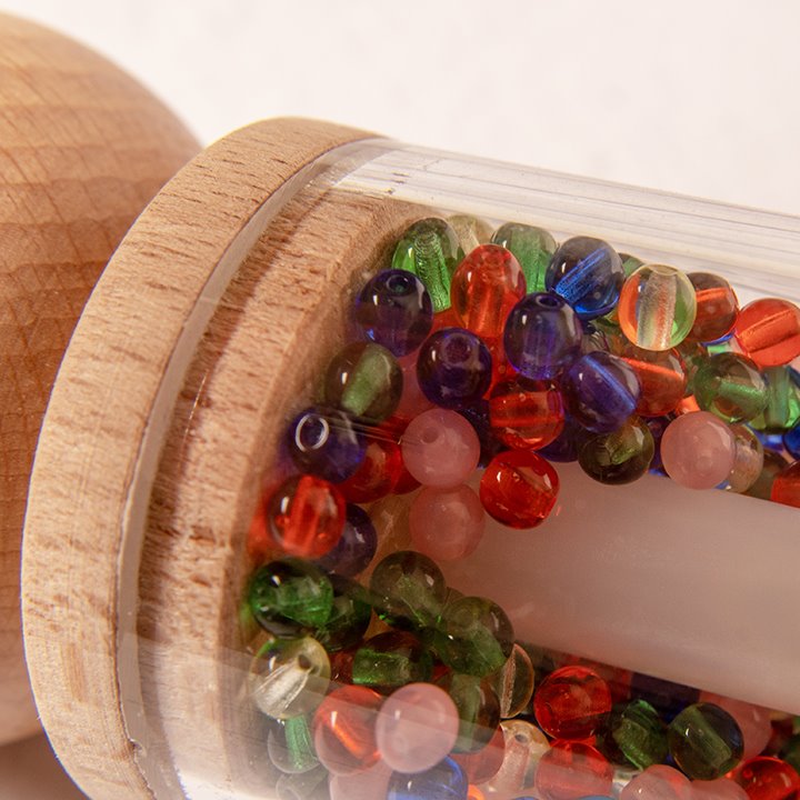 Close up of rainbow beads in rattle roller