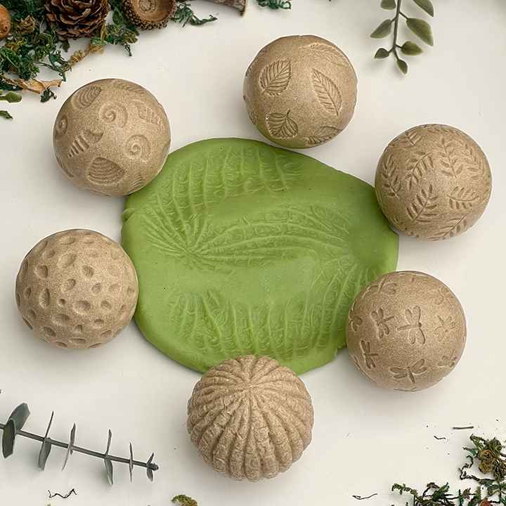 Six textured balls for rolling