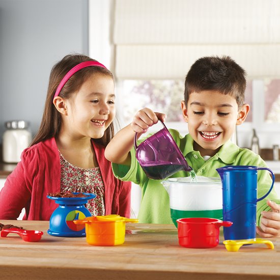 Children playing with mix and measure set