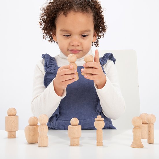 Child with Beechwood figures for small world play