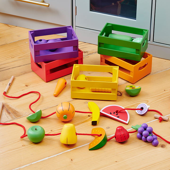 5 wooden crates filled with wooden fruit and vegetable piece