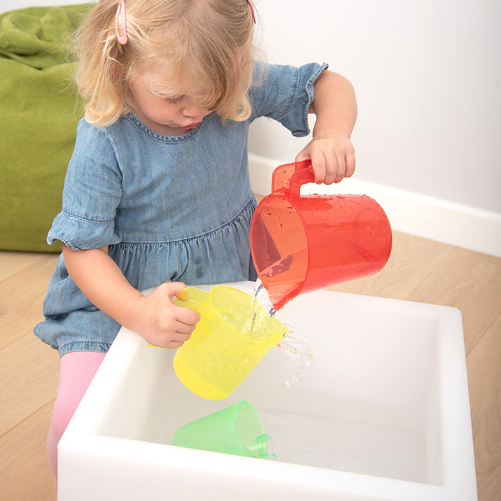 Pouring wayter from one jug to another