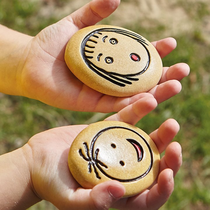 Happy and surprised emotion stones