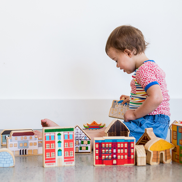 Playing with wooden houses
