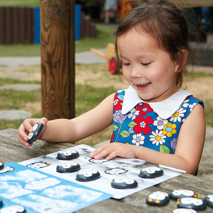 Happy child matching with cute penguin shape