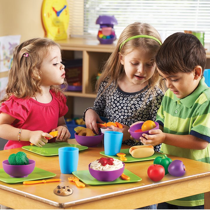 Children enjoying their play food role play