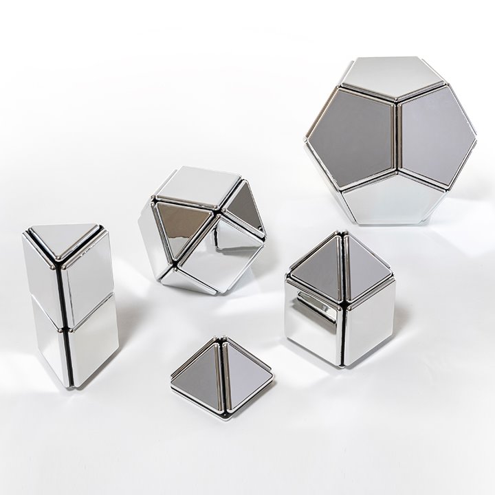 Shapes made from mirrored magnetic triangles, squares and pentagons