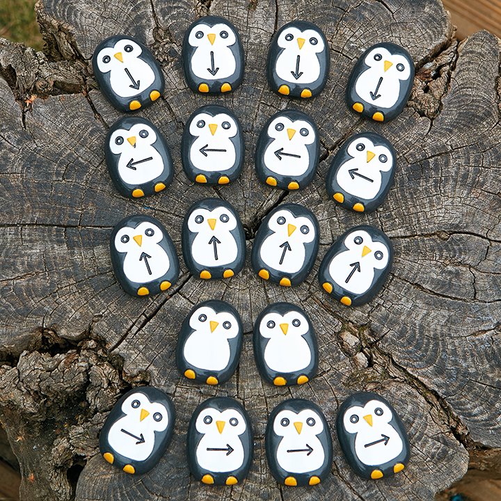 Set of cute penguins with arrows