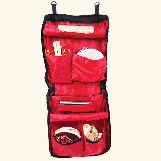 Red hanging bag storing instruments