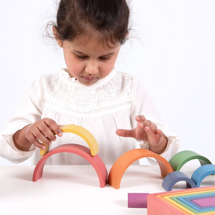 Seven colourful wooden shapes. A great STEM addition.