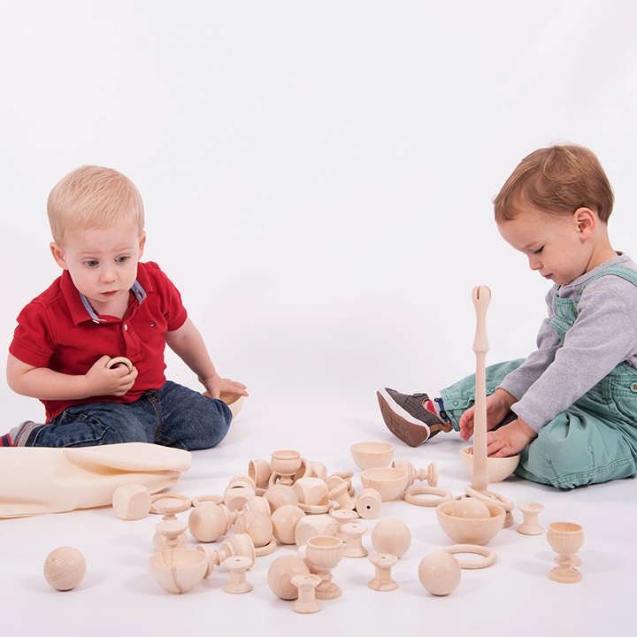 Two children playing with heuristic play set